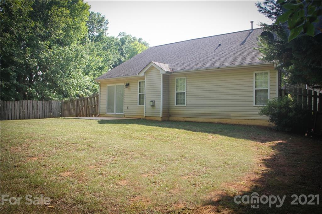 11233 Dickie Ross Road Charlotte, NC 28277 - Photo 22 of 26 a view of a house with backyard and tree
