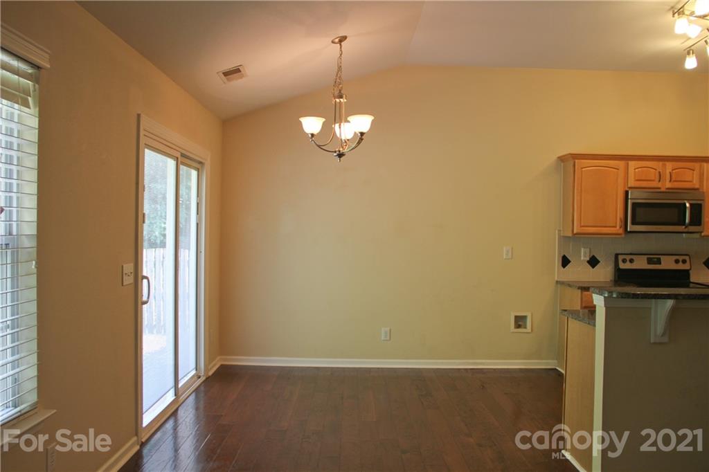 11233 Dickie Ross Road Charlotte, NC 28277 - Photo 7 of 26 a view of a livingroom with a chandelier