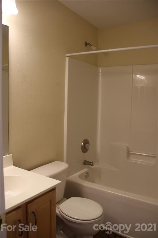11233 Dickie Ross Road Charlotte, NC 28277 - Photo 9 of 26 a bathroom with a toilet a sink and shower