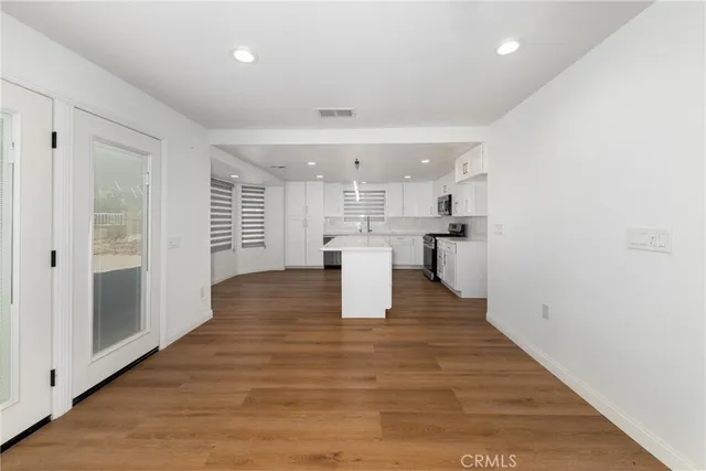a view of kitchen with wooden floor
