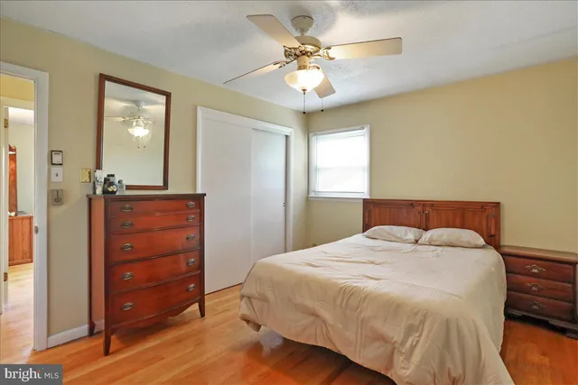 a bedroom with a bed and a dresser