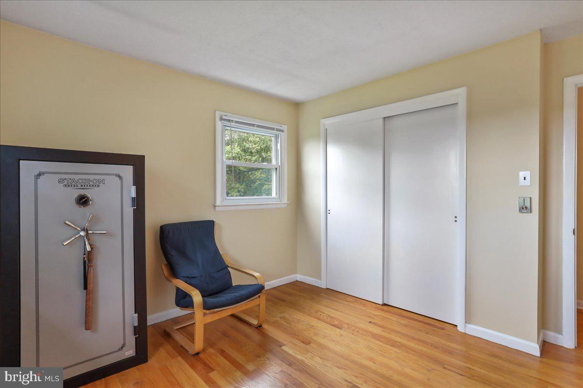 1956 Cattail Run Road Charles Town, WV 25414 - Photo 13 of 29 a bedroom with a chair and wooden floor
