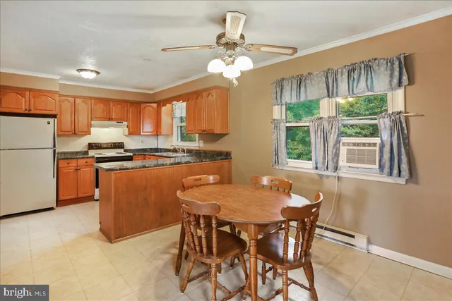 a view of a dining room with furniture window and outside view