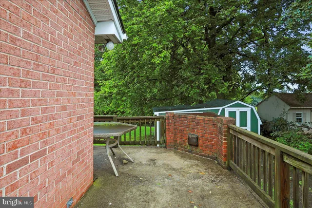 a view of a brick house with a yard