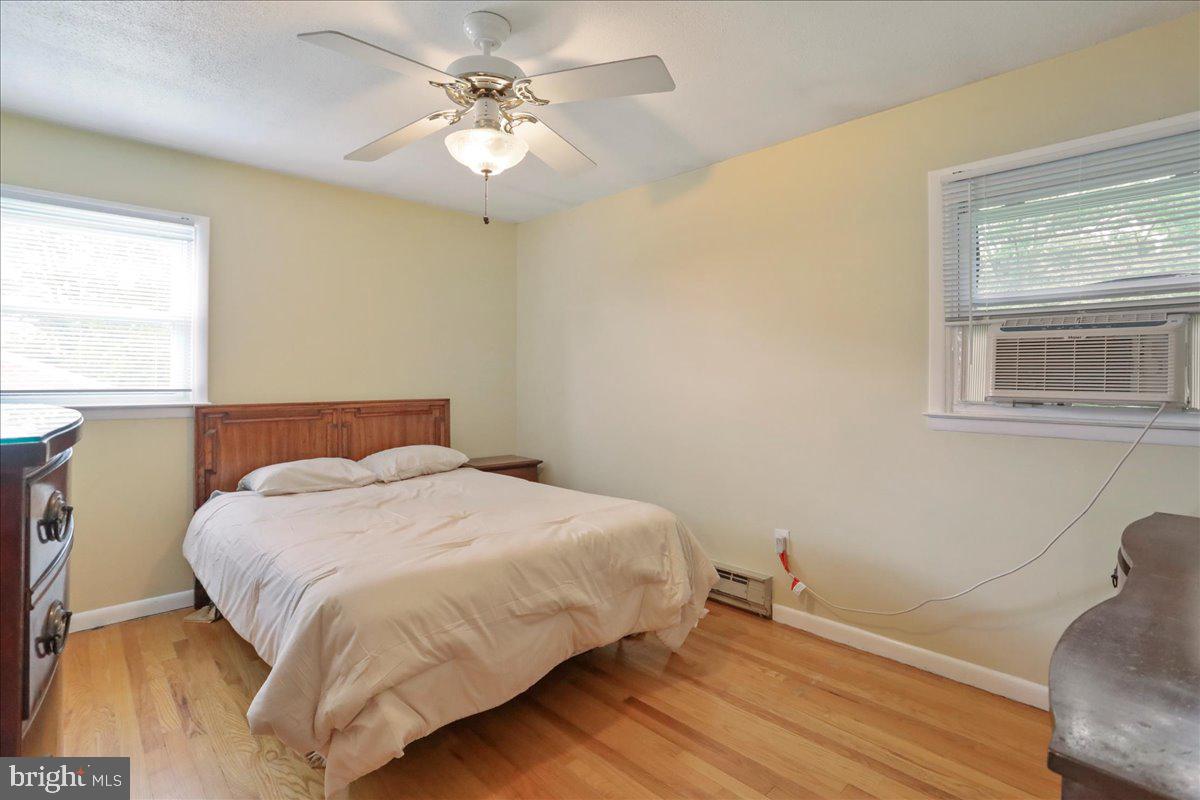 1956 Cattail Run Road Charles Town, WV 25414 - Photo 9 of 29 a bedroom with a bed chandelier and a window