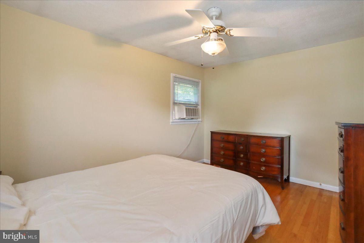 1956 Cattail Run Road Charles Town, WV 25414 - Photo 10 of 29 a bedroom with a bed chandelier and a window