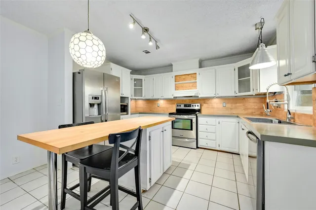a kitchen that has a counter space and a sink in it