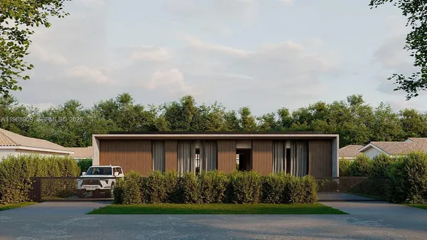 a view of backyard of house with seating and green space