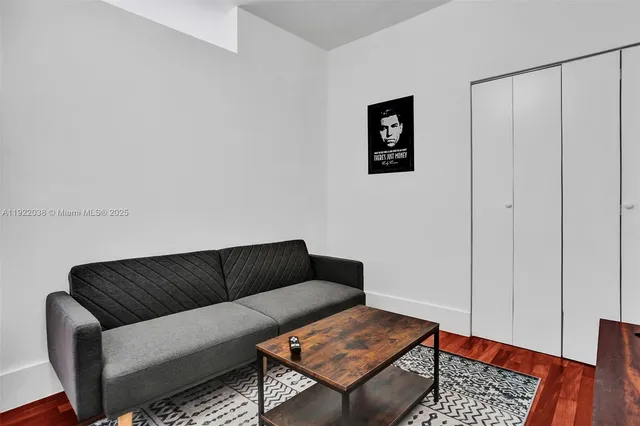 a living room with furniture and a rug