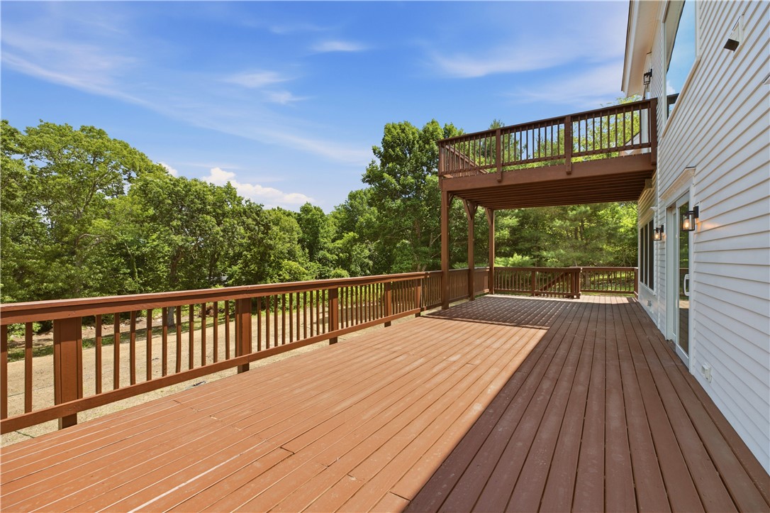 26 Old Stone Church Road Little Compton, RI 02837 - Photo 17 of 49 Additional outdoor space galore on spacious deck along back of first floor living space