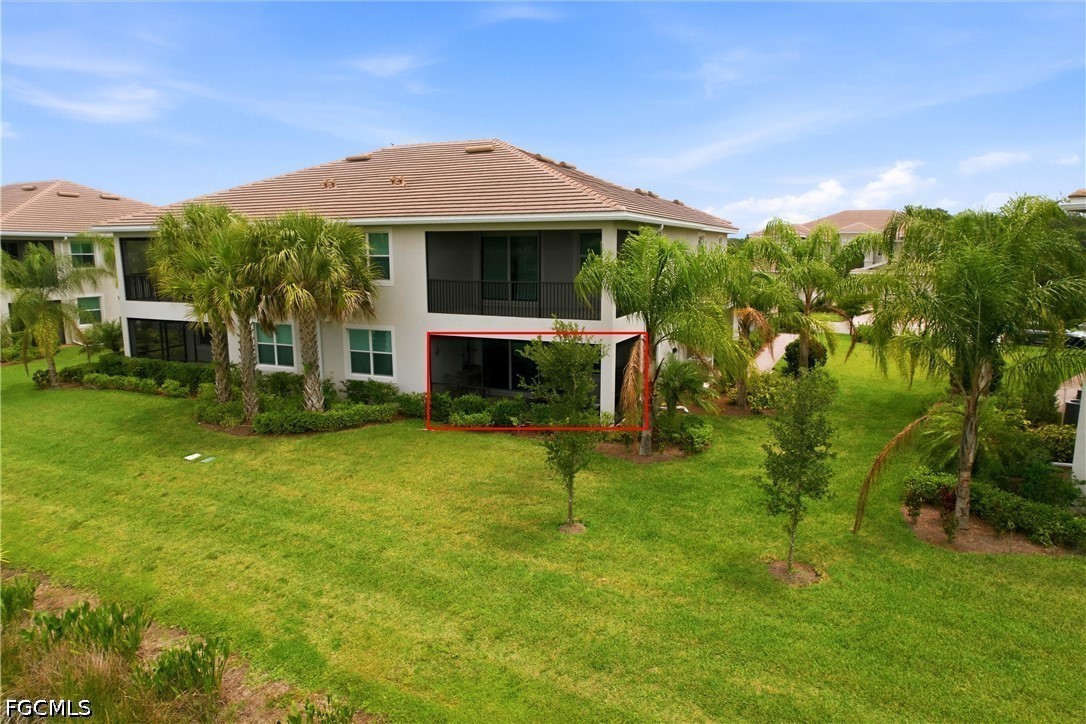 3751 Pebblebrook Ridge Court, Unit 101 Fort Myers, FL 33905 - Photo 3 of 48 a front view of a house with a yard