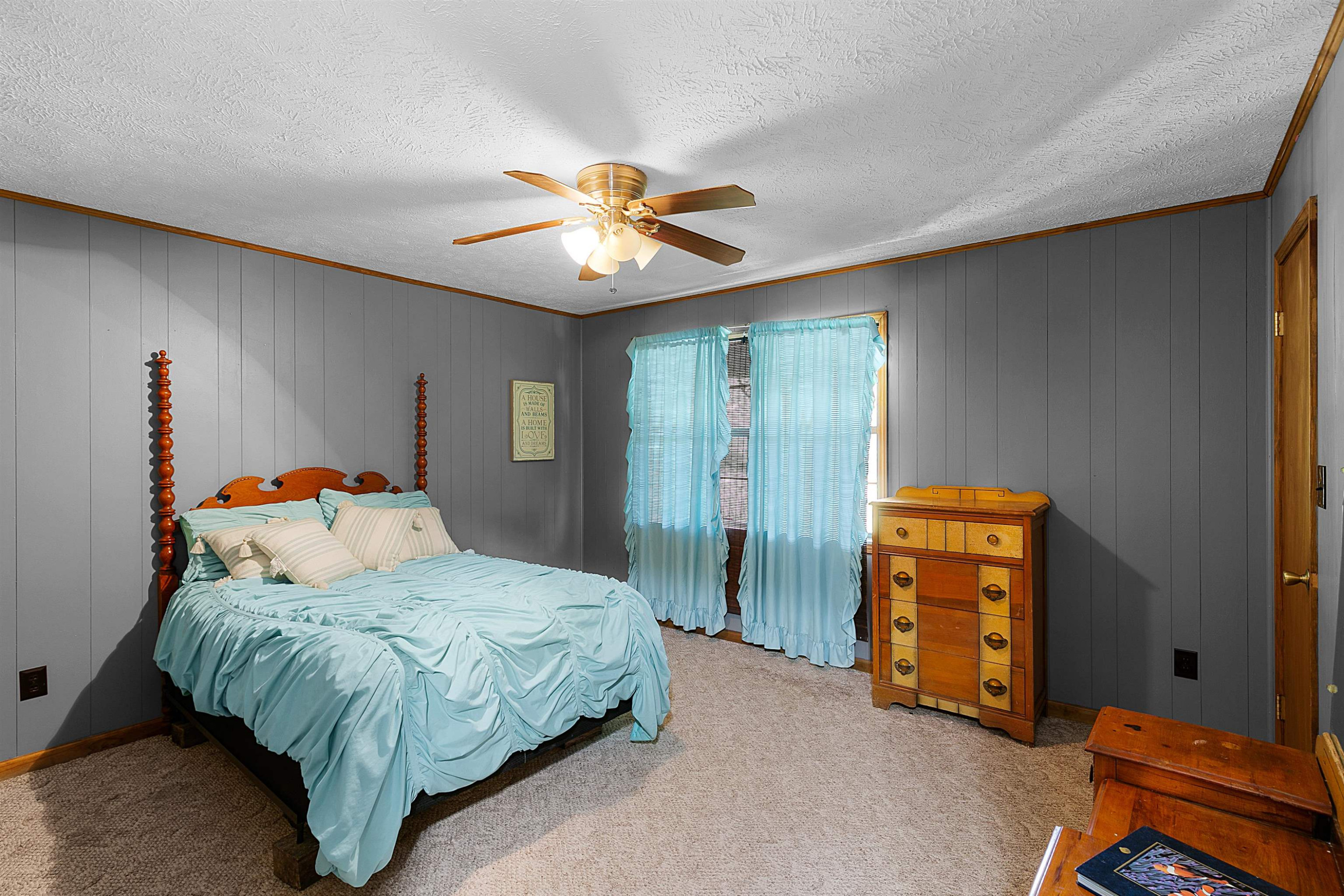 475 Liberty Claybrook Road Beech Bluff, TN 38313 - Photo 11 of 18 a bedroom with a bed and a chandelier