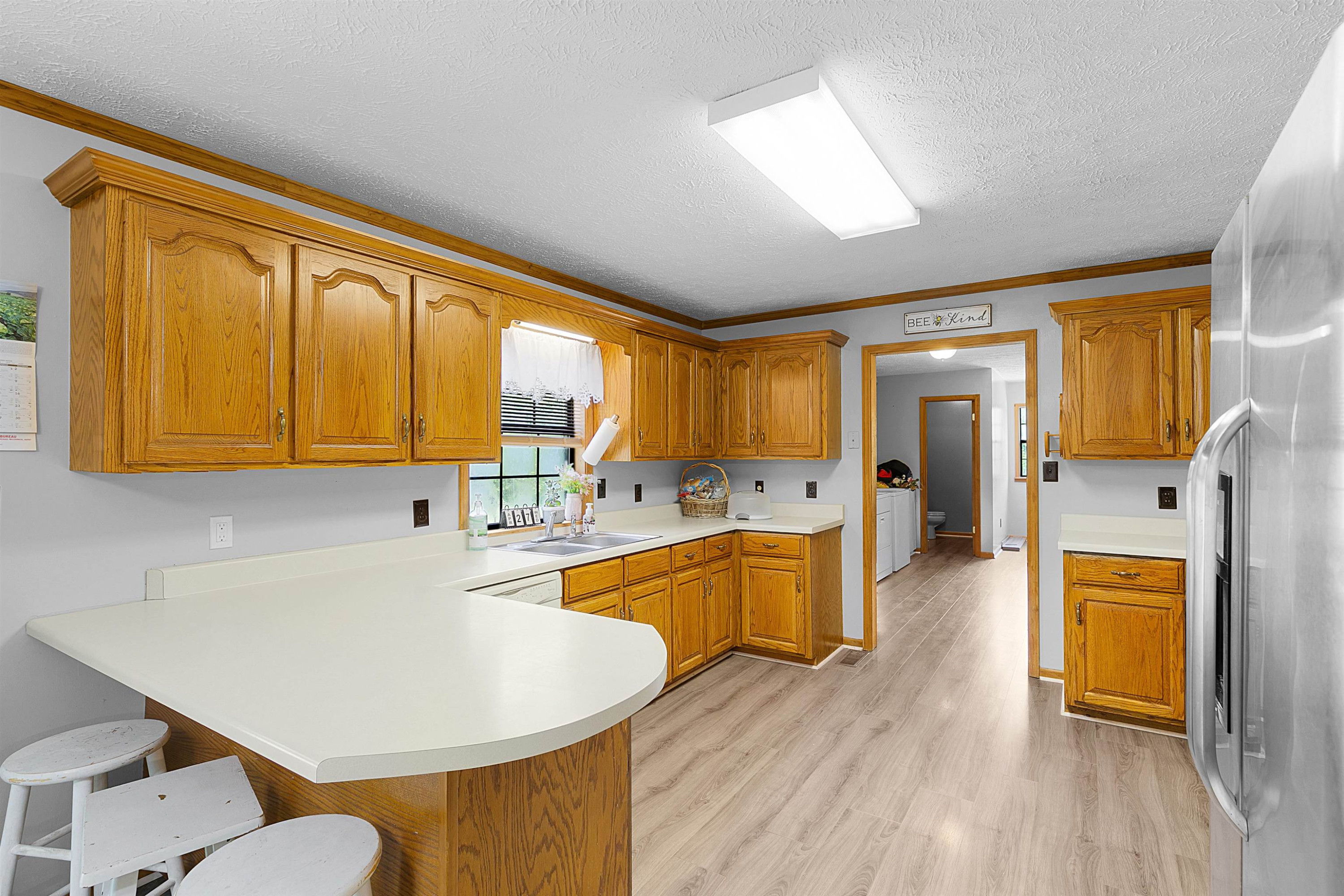 475 Liberty Claybrook Road Beech Bluff, TN 38313 - Photo 6 of 18 a large kitchen with stainless steel appliances granite countertop a sink a stove and a refrigerator