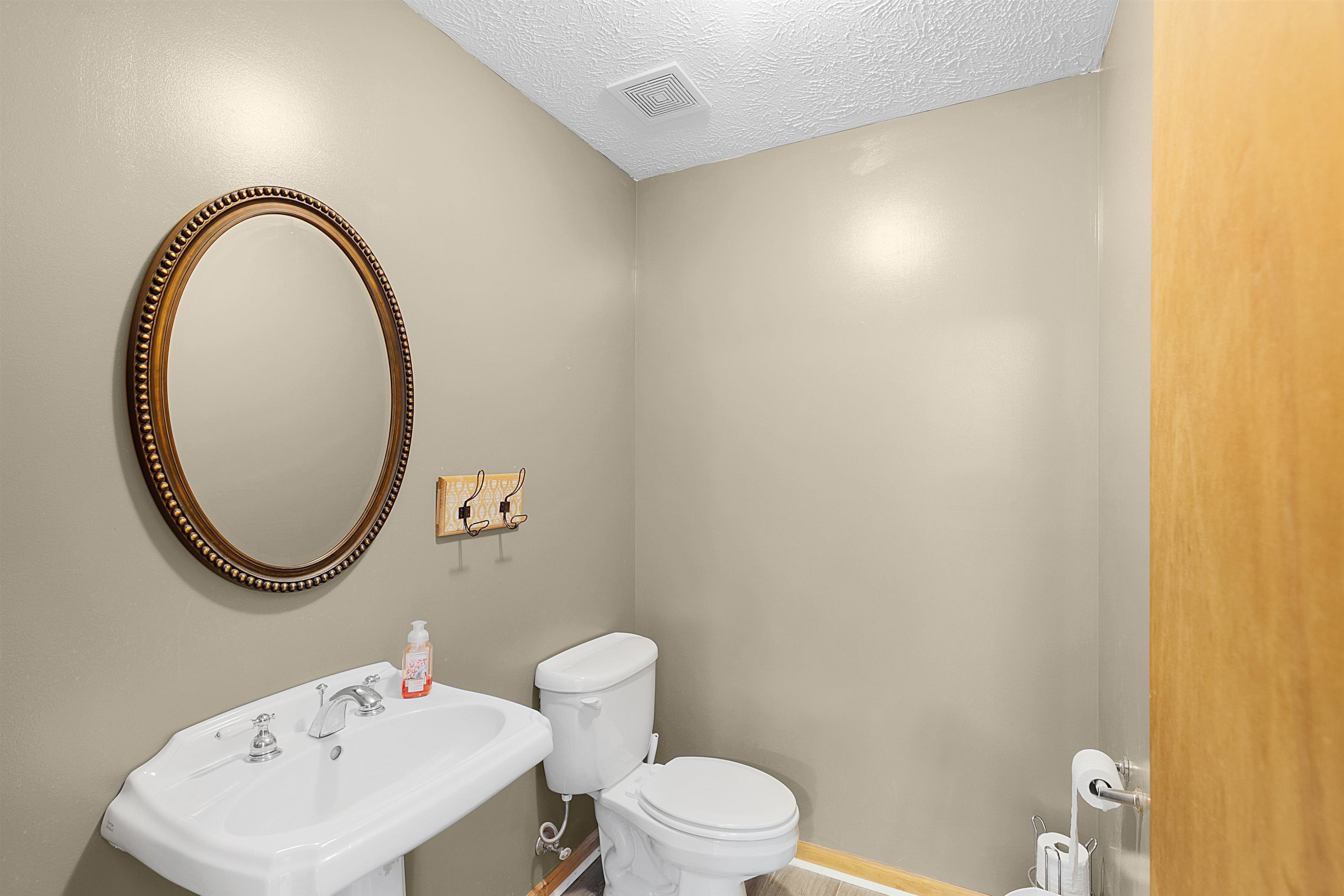 475 Liberty Claybrook Road Beech Bluff, TN 38313 - Photo 10 of 18 a bathroom with a sink and a mirror