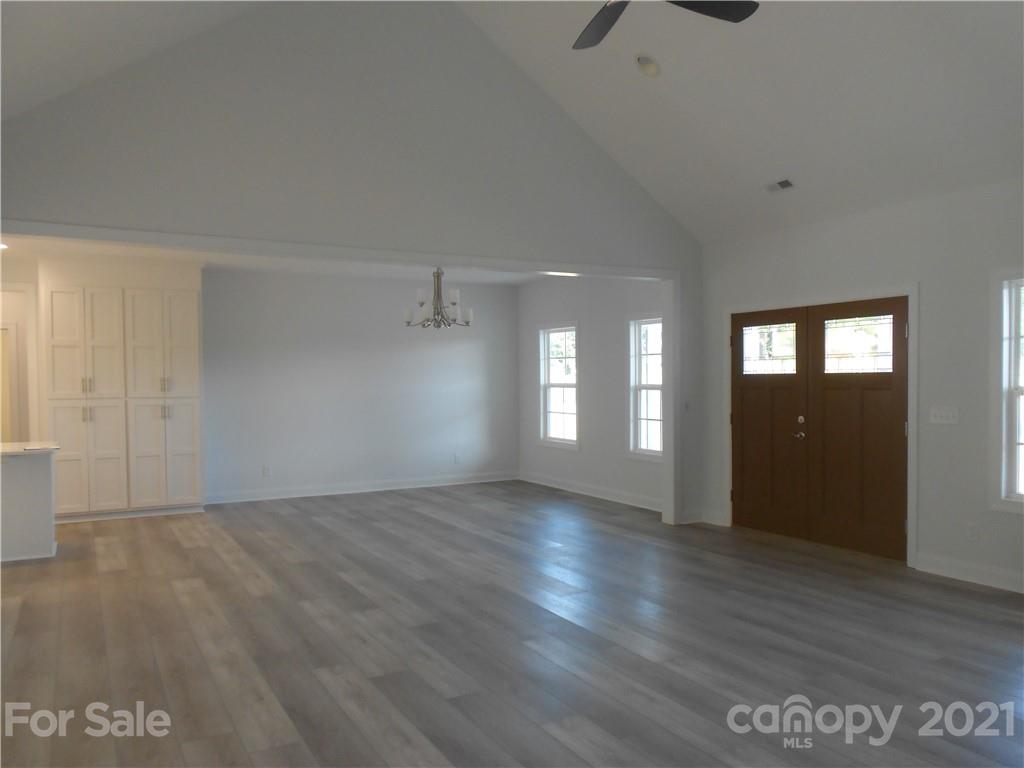 2309 New Salem Road Monroe, NC 28110 - Photo 12 of 26 a view of wooden floor and windows in an empty room
