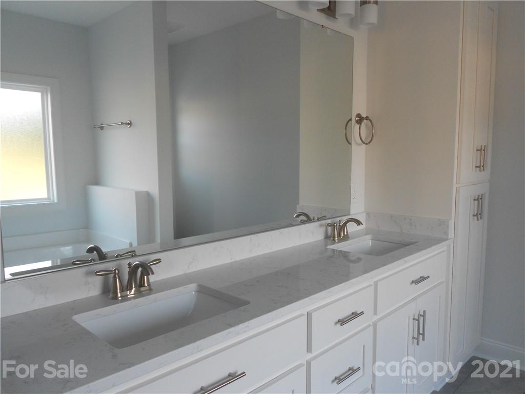 2309 New Salem Road Monroe, NC 28110 - Photo 23 of 26 a bathroom with a sink and a mirror