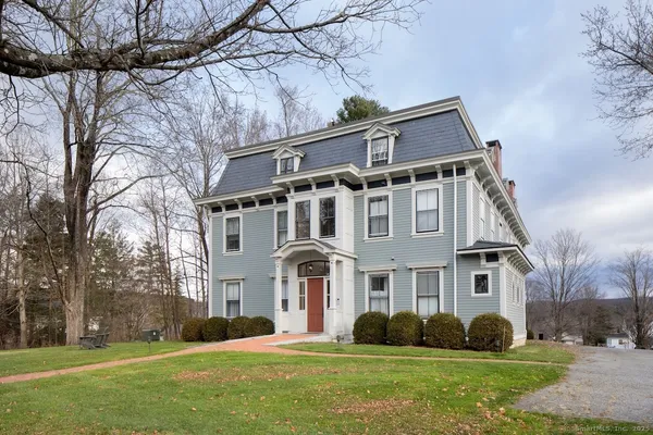 a front view of a house with a yard