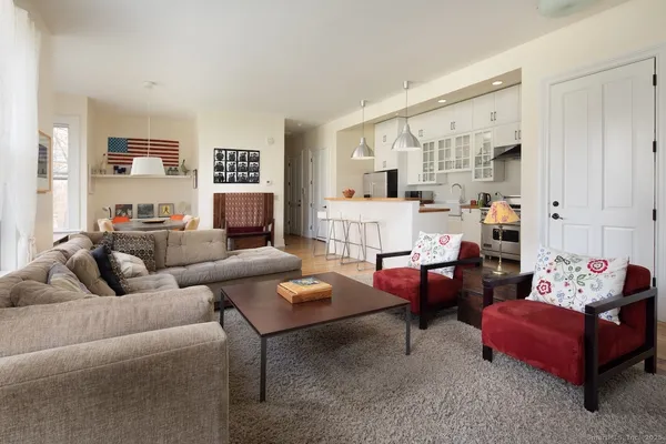 a living room with furniture and a large window