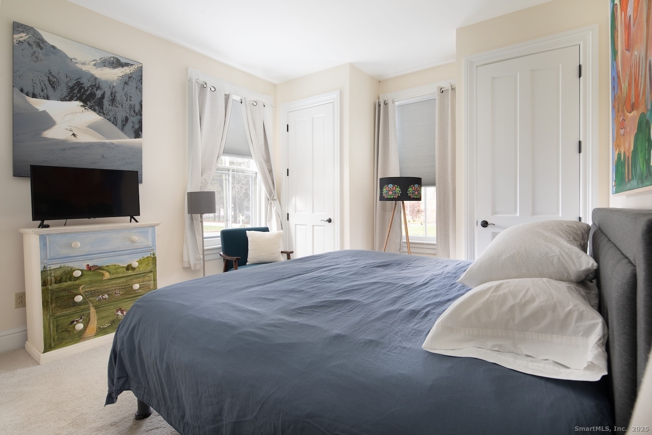 31 Sharon Road, Unit 2 Salisbury, CT 06039 - Photo 7 of 15 a bedroom with a bed and a flat screen tv