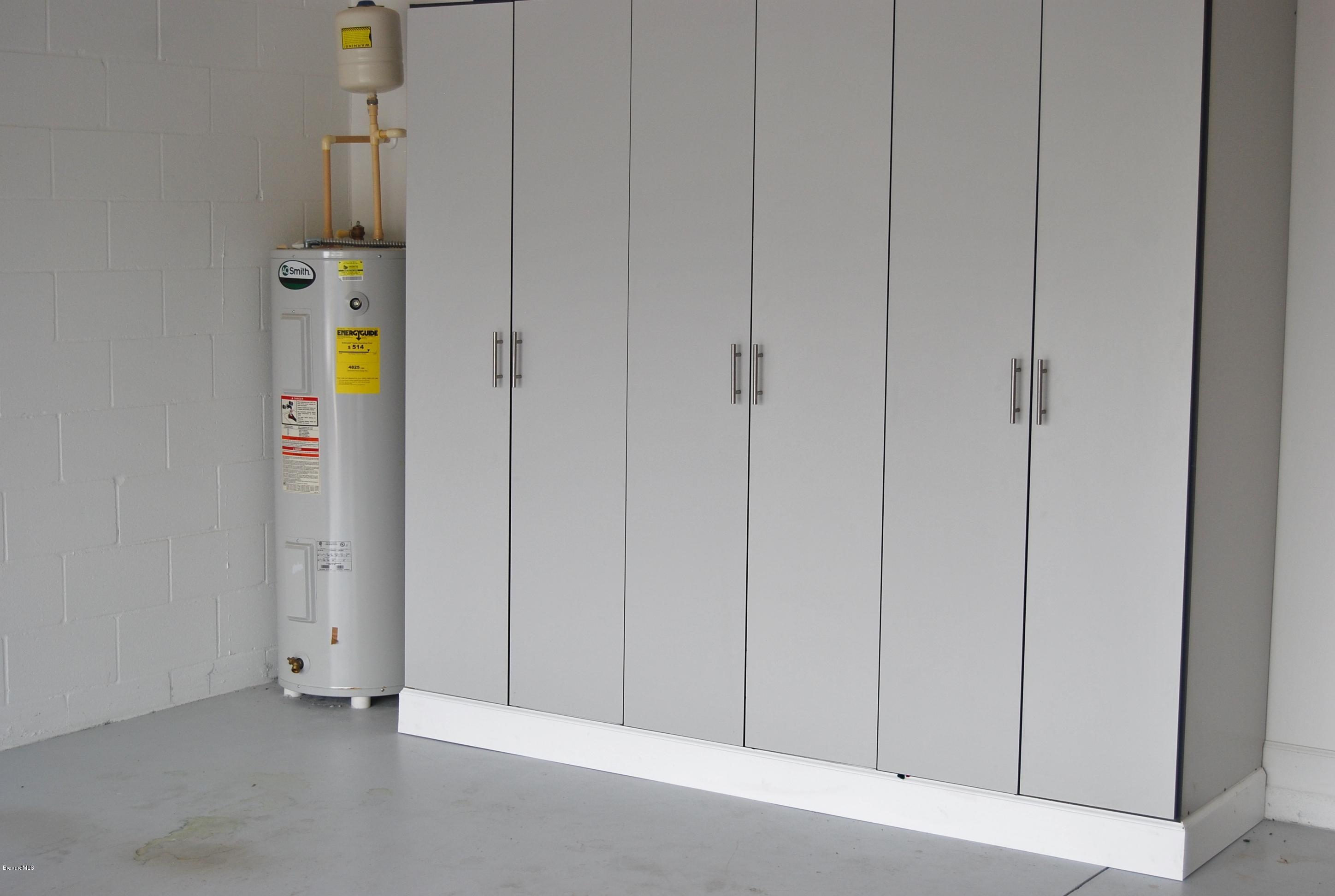 3479 Ahern Place Melbourne, FL 32940 - Photo 16 of 19 Garage built in cabinets