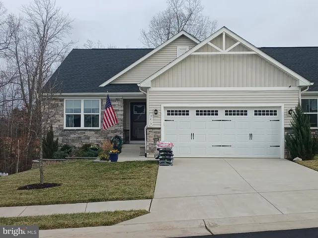 a front view of a house with garage