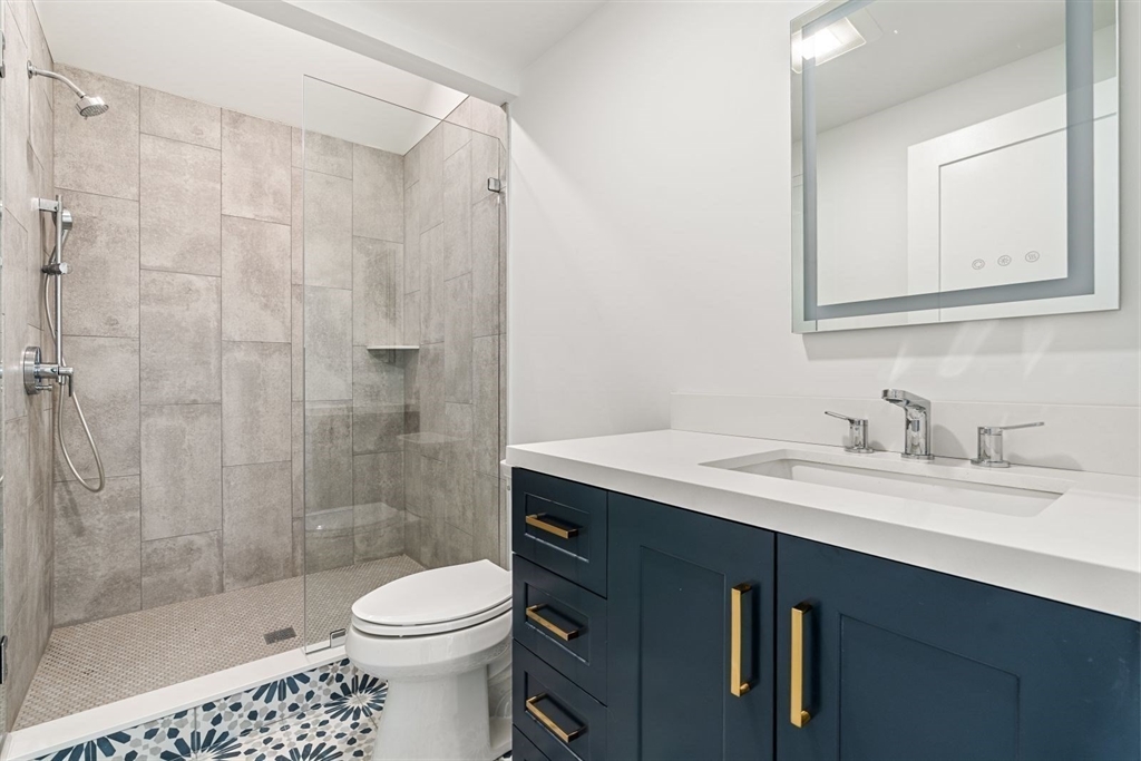 14 Ruel Drive Dover, MA 02030 - Photo 18 of 41 a bathroom with a sink a toilet and shower