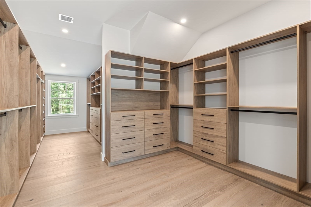 14 Ruel Drive Dover, MA 02030 - Photo 24 of 41 a view of walk in closet with clothes and shoes