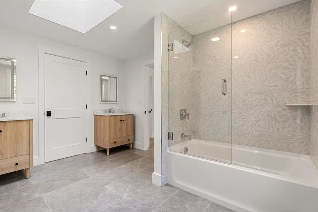 a view of room with wooden floor and white walls