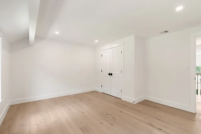 a bathroom with a sink a toilet a shower and a mirror