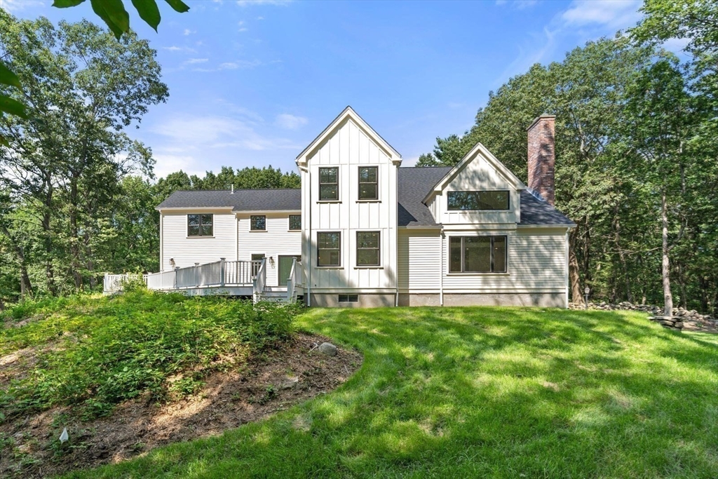 14 Ruel Drive Dover, MA 02030 - Photo 3 of 41 a house view with a garden space