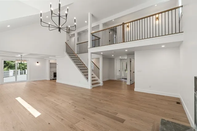 a view of an entryway with wooden floor