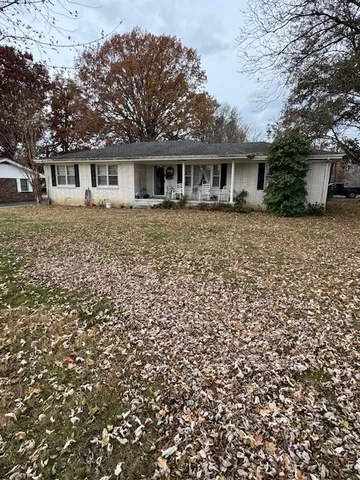 front view of a house with a garden