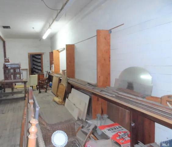 a living room with furniture and flat screen tv