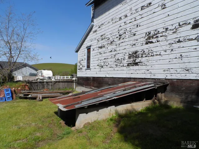 a swimming pool with outdoor seating and yard
