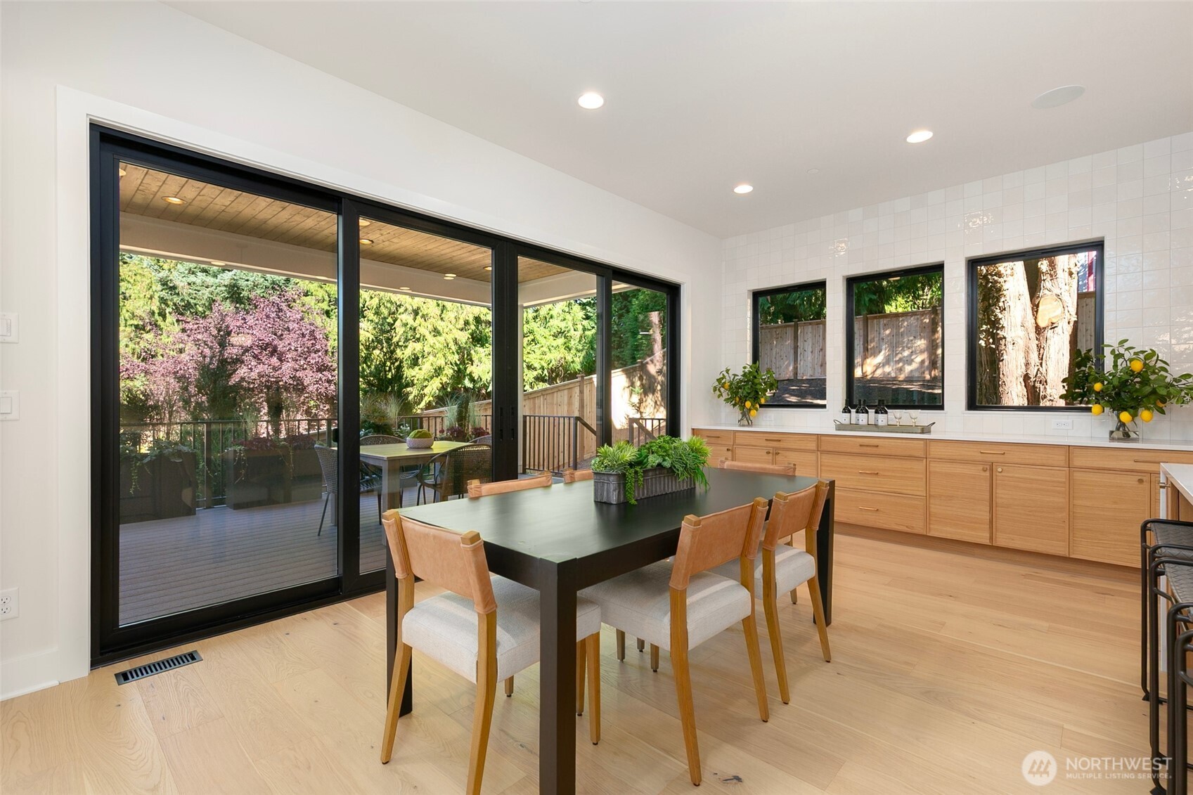 308 124th Place Northeast Bellevue, WA 98005 - Photo 11 of 39 a dining room with furniture and large windows
