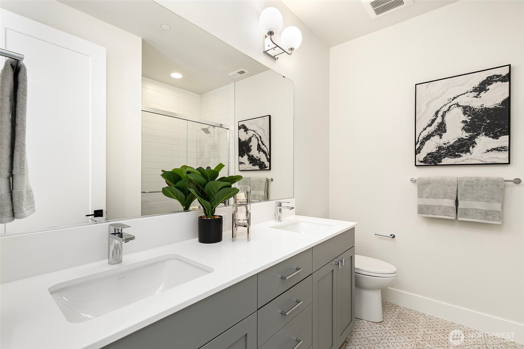 308 124th Place Northeast Bellevue, WA 98005 - Photo 22 of 39 a bathroom with a toilet a sink and mirror