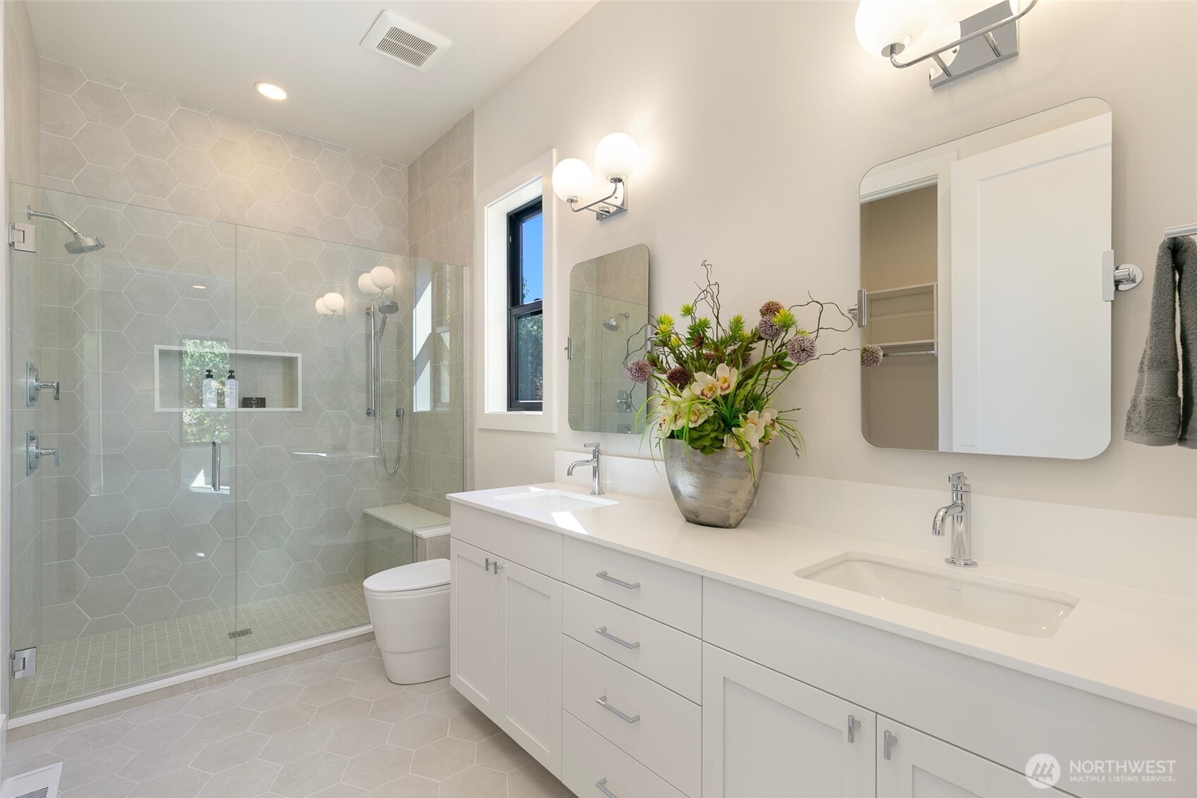 308 124th Place Northeast Bellevue, WA 98005 - Photo 25 of 39 a bathroom with double vanity sinks a shower and a mirror