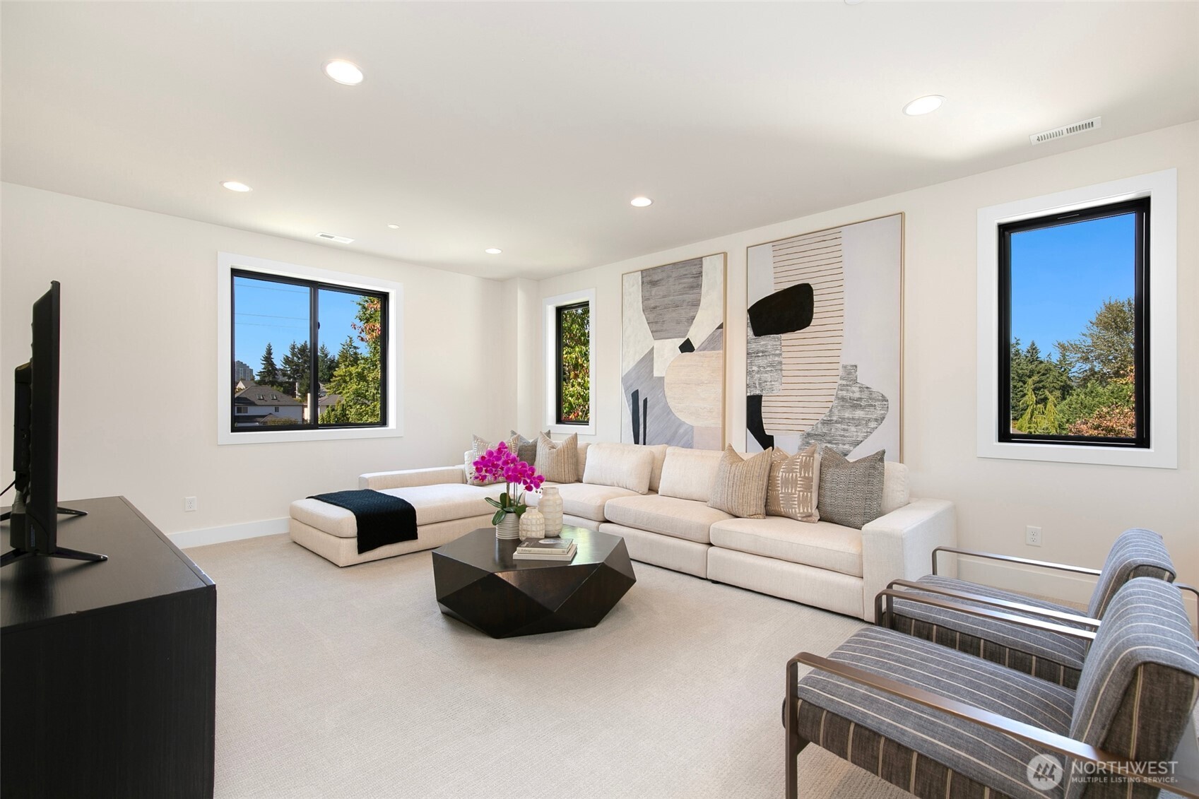 308 124th Place Northeast Bellevue, WA 98005 - Photo 27 of 39 a living room with furniture and a flat screen tv