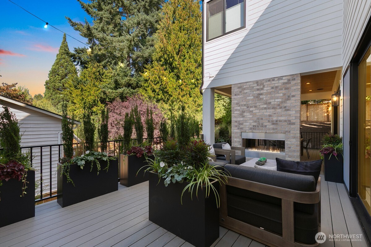 308 124th Place Northeast Bellevue, WA 98005 - Photo 38 of 39 a view of house with patio outdoor seating and wooden floor