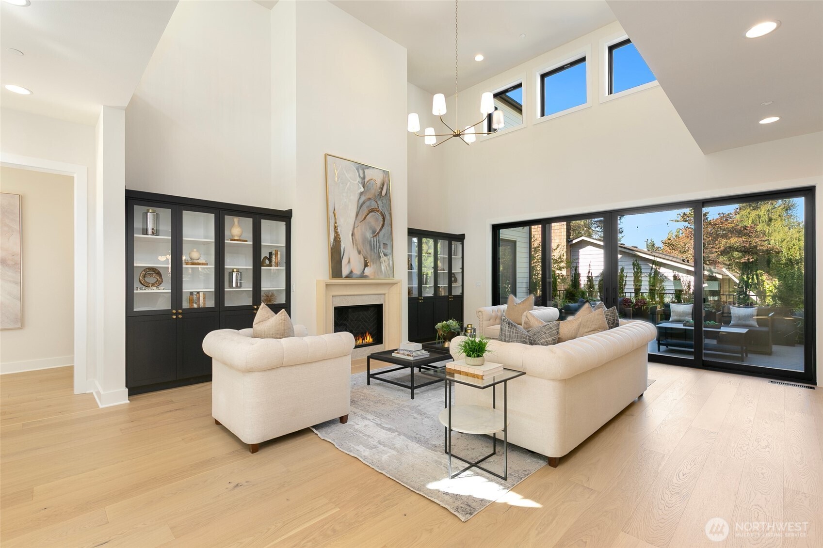 308 124th Place Northeast Bellevue, WA 98005 - Photo 5 of 39 a living room with fireplace furniture and a large window