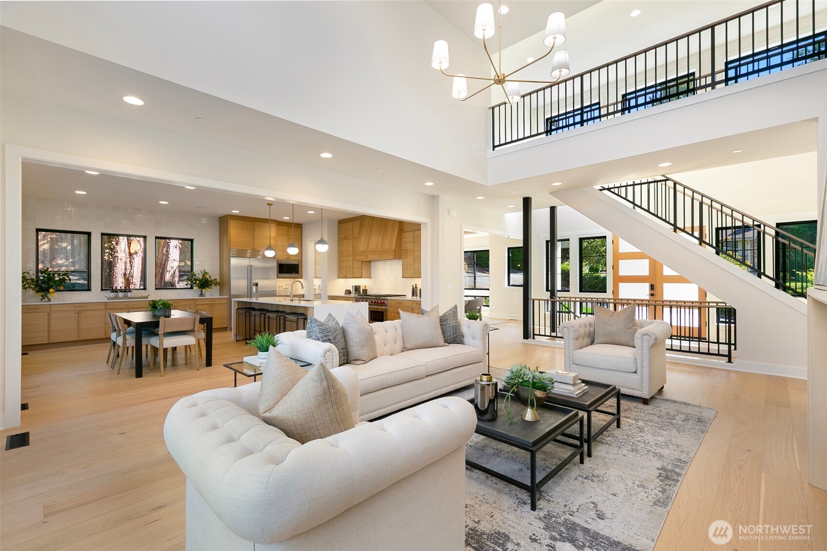 308 124th Place Northeast Bellevue, WA 98005 - Photo 6 of 39 a living room with furniture kitchen view and a wooden floor