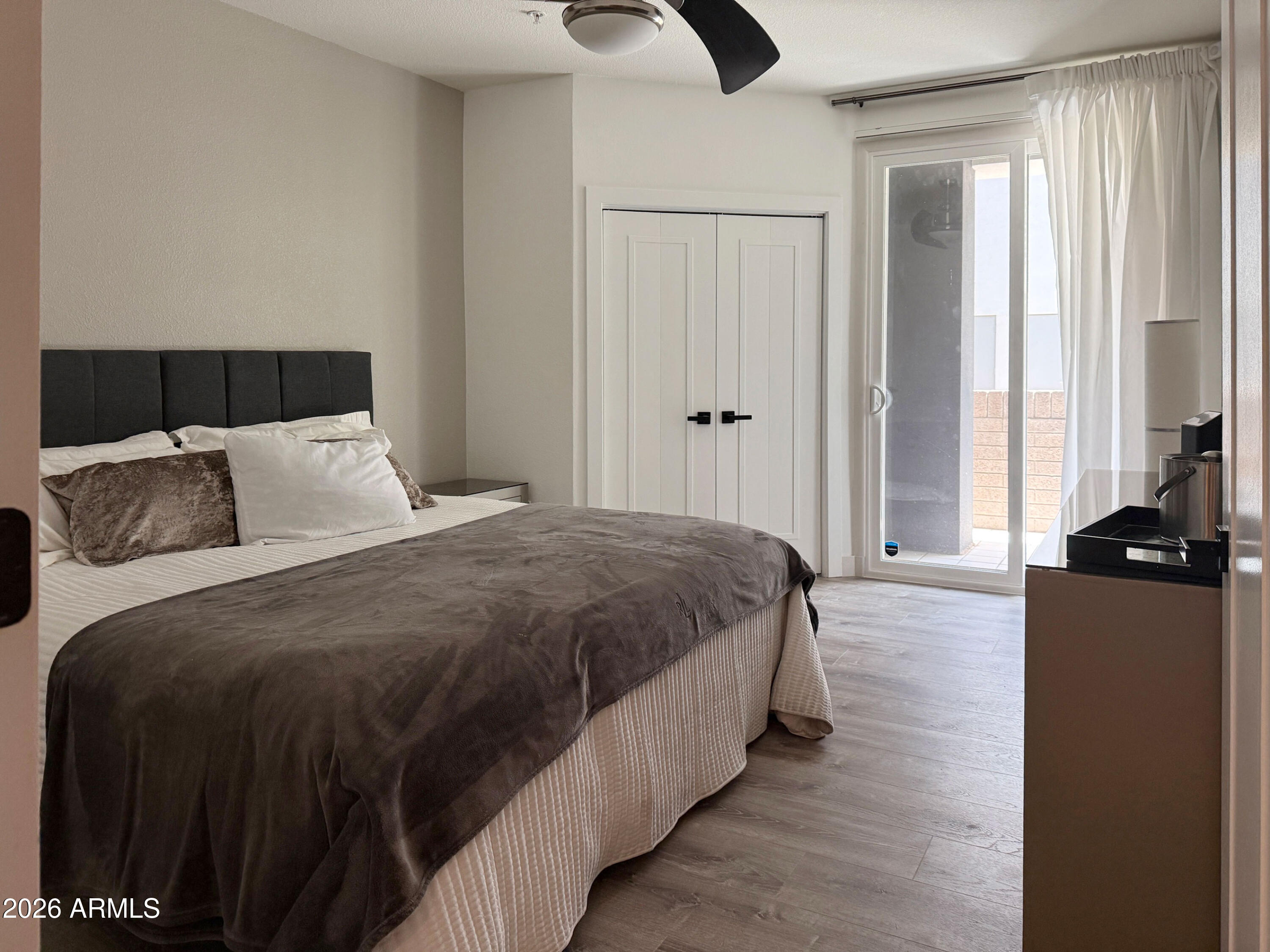 3633 North 3rd Avenue, Unit 1027 Phoenix, AZ 85013 - Photo 9 of 29 a bedroom with a bed and window