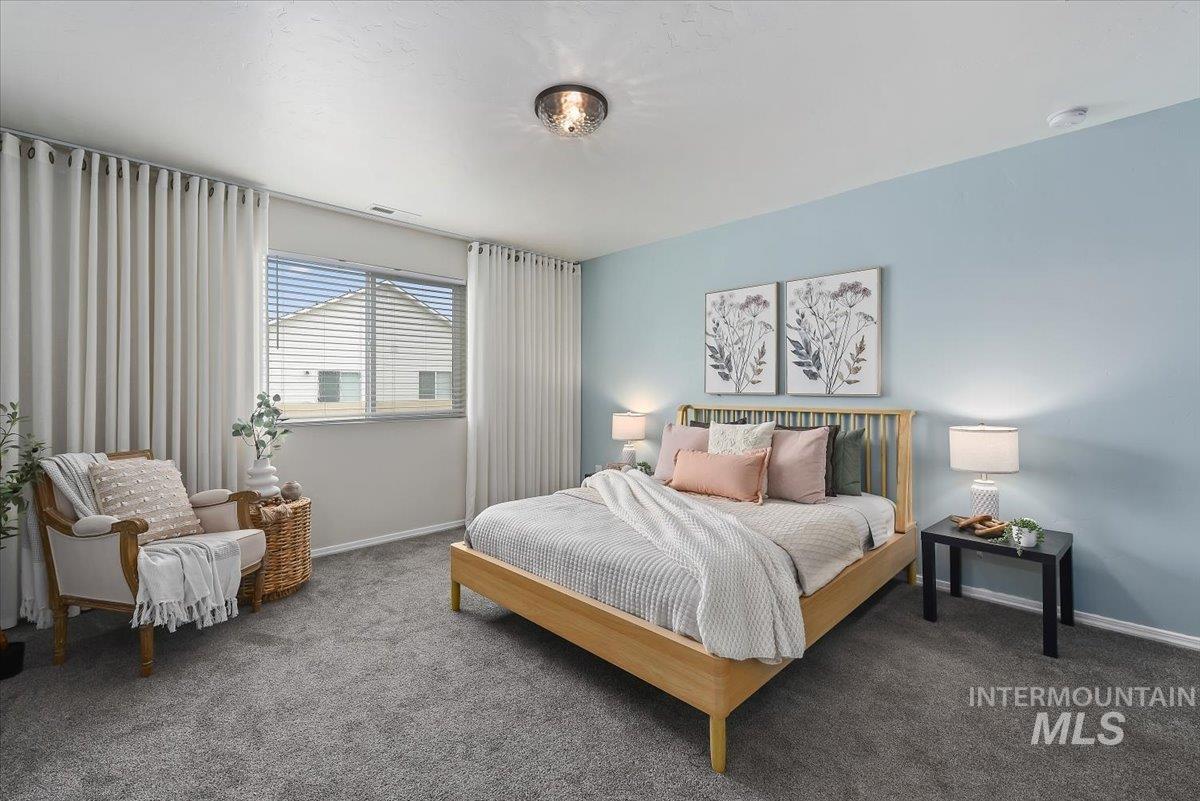 12781 Ashfield Street Caldwell, ID 83607 - Photo 18 of 36 Carpeted bedroom featuring baseboards