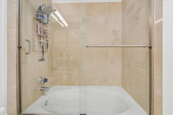 a bathroom with a white bath tub