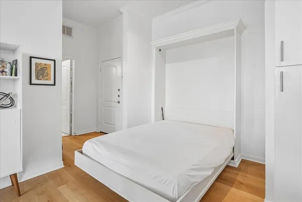 a bed room with a bed and a night stand