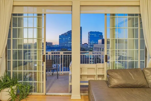 a view of a balcony and a potted plant