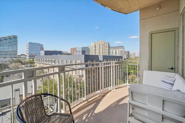 a view of a balcony with city view