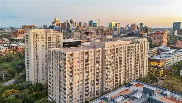 a view of city with tall buildings