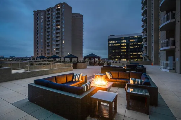 a swimming pool with outdoor seating