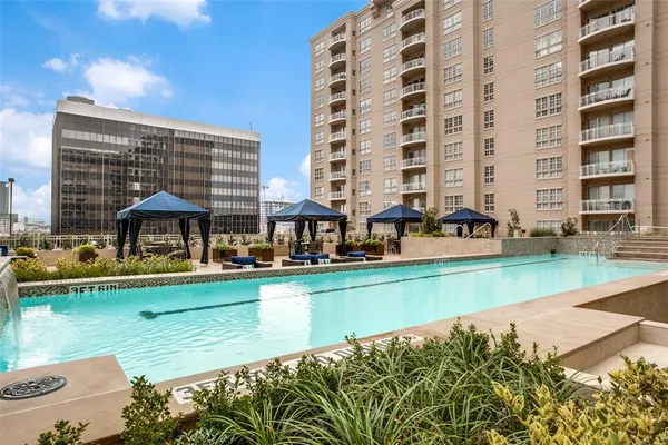a view of swimming pool with outdoor seating